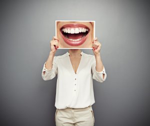 person holding a smiling picture