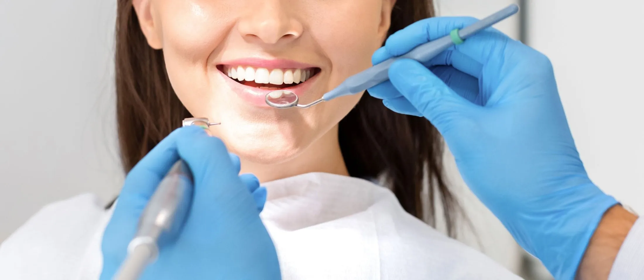woman getting checked by the dentist
